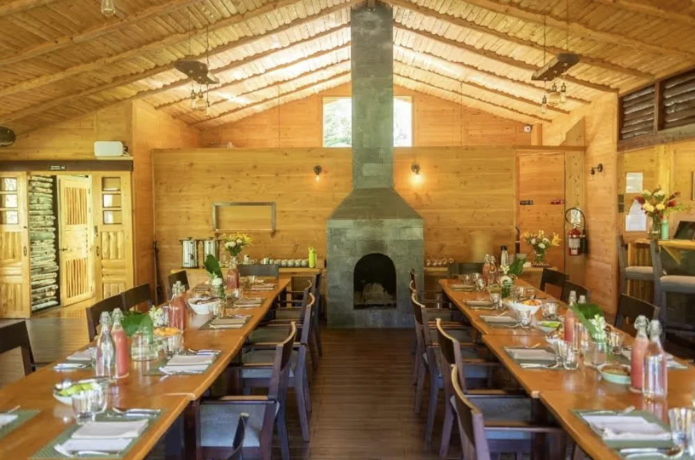 Communal dining hall by the fireplace